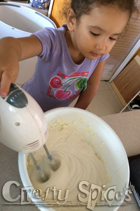 Our two little girls having fun and learning in the Kitchen Our little girl having fun and learning in the Kitchen