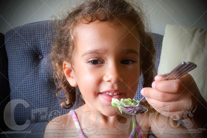 Kira helping us put the cream cheese into the prunes