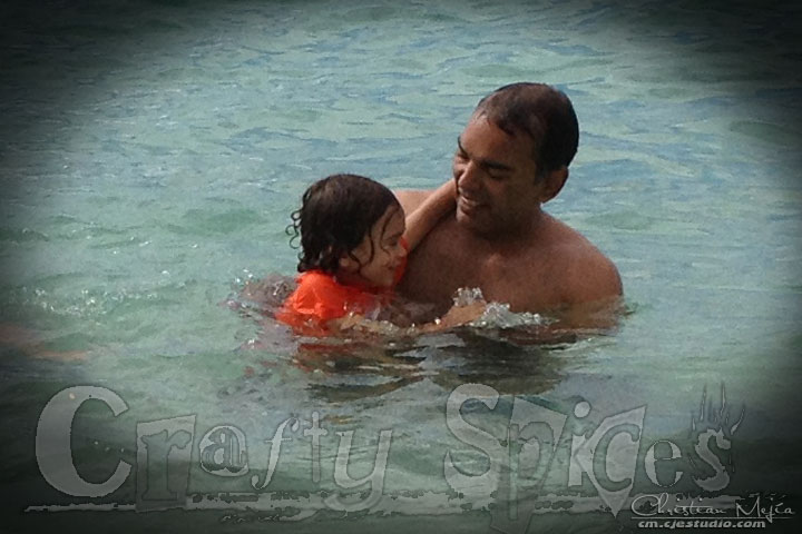 Kira having fun with Tio Cesar at the beach