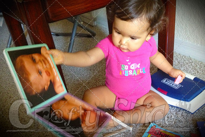 Kaylee looking at a book