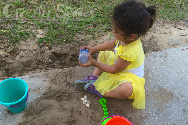 A Beach Day, without the Beach… Kaylee playing with sand