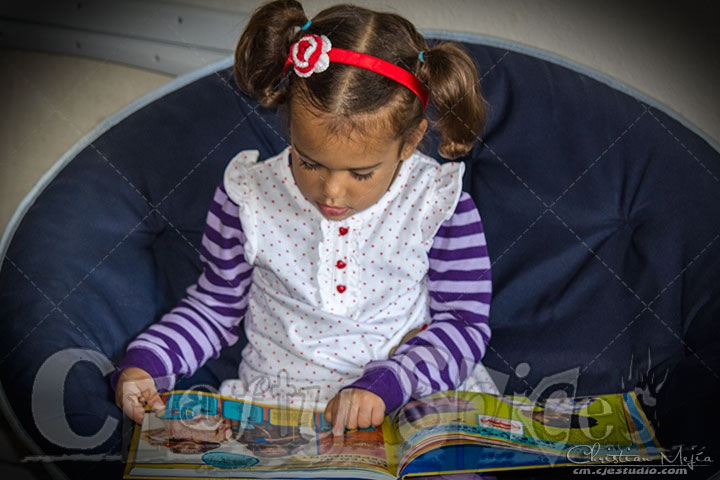 Kira enjoying a National Geographic book