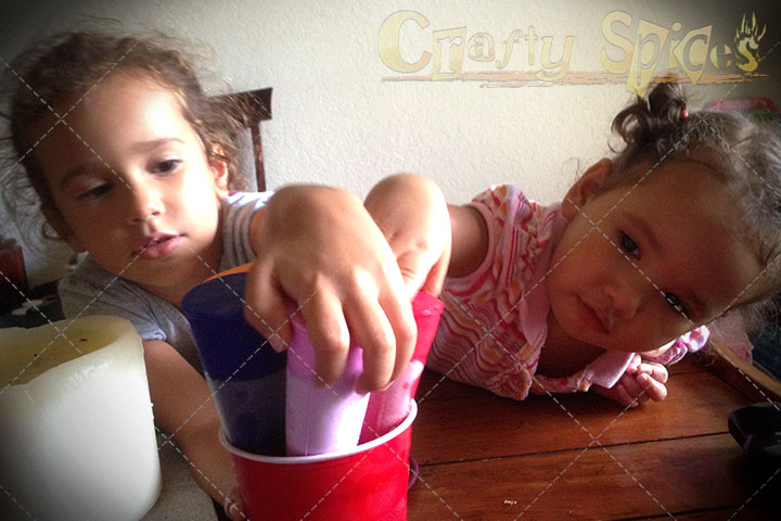 Kira and Kaylee trying to take an Ice Pop Kira and Kaylee trying to take an Ice Pop