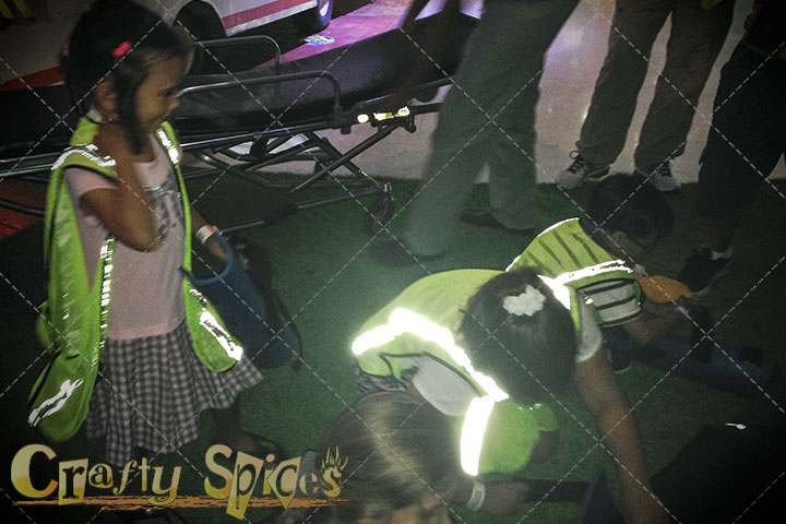 Children helping an injured person (make believe)