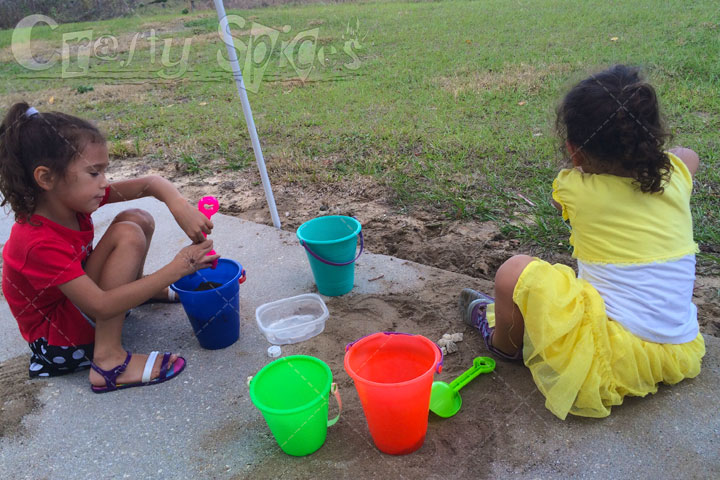 The Girls playing with Sand in our backyard